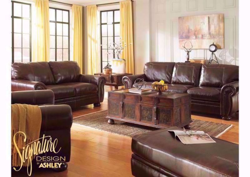 Room View of the Banner Sofa Set by Ashley Furniture, Set includes Sofa, Loveseat and Chair Covered in a Brown Top Grain Brown Leather Upholsterly  | Home Furniture Plus Bedding