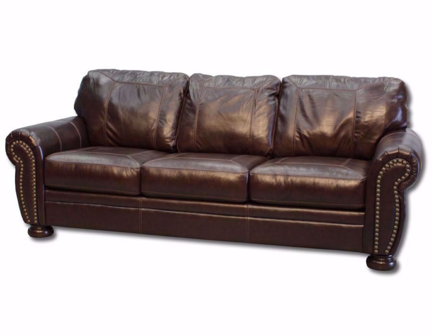 Slightly Angled View of Banner Sofa by Ashley Furniture with Brown Top Grain Leather Upholstery and Nailhead Trim Accents | Home Furniture Plus Bedding