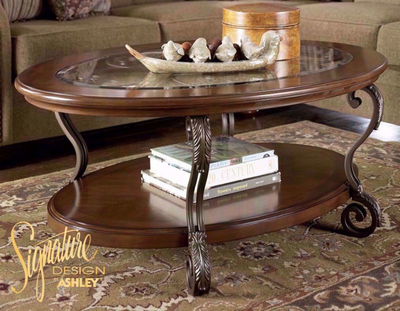 Side View of the Brown Nestor Coffee Table in Room Setting by Ashley Furniture | Home Furniture Plus Bedding