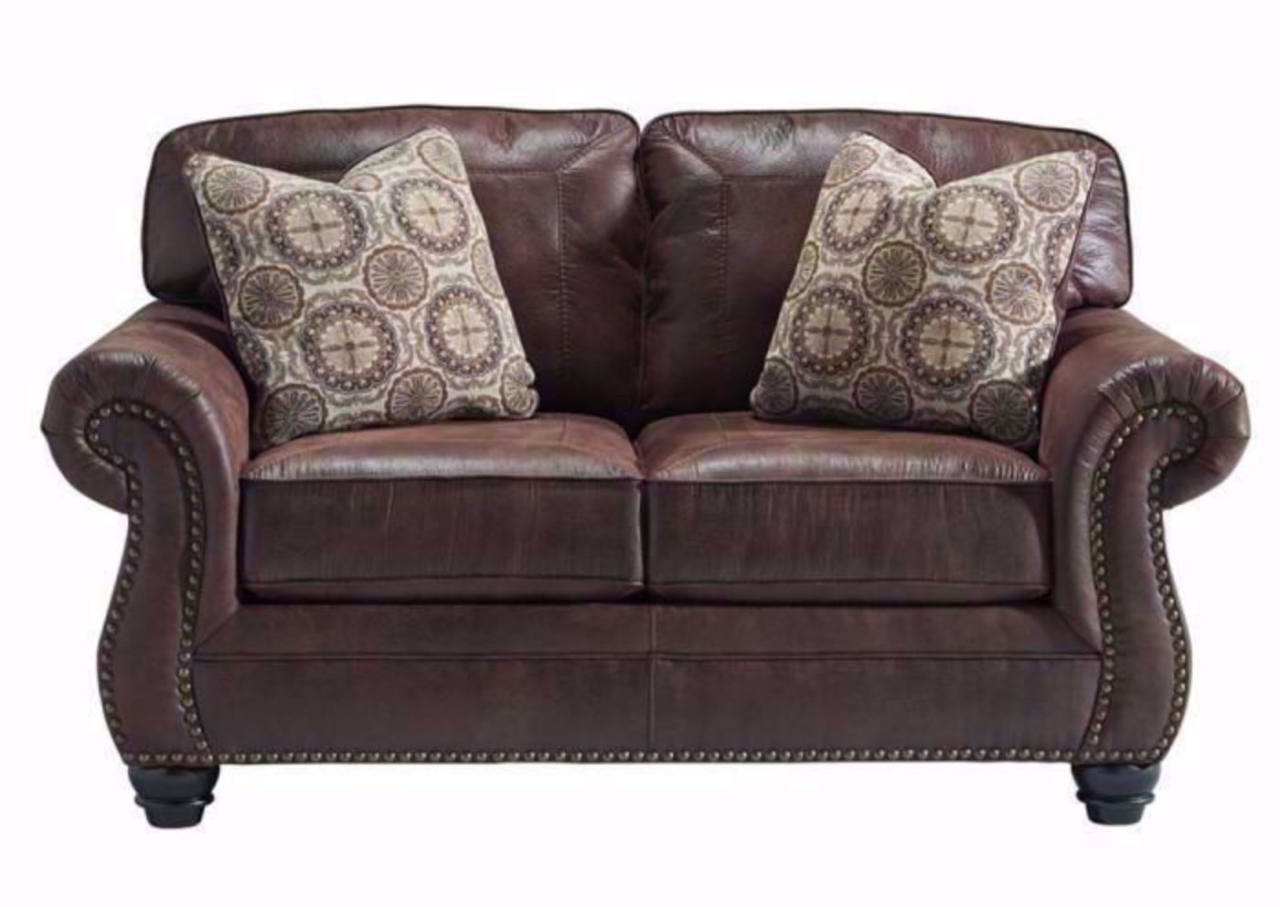Breville Loveseat by Ashley Furniture Covered in a Dark Brown Leather Like Upholstery with 2 Accent Pillows | Home Furniture Plus Bedding