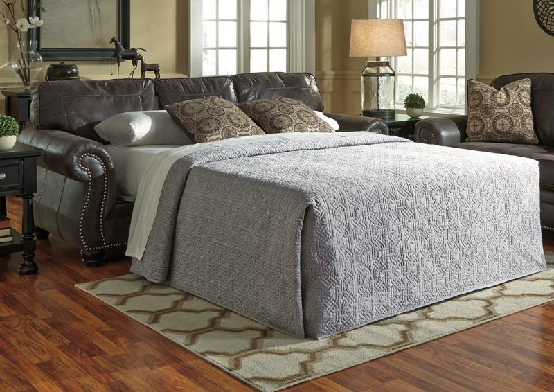 Slighlty Angled Gray Breville Sleeper Sofa by Ashley Furniture with Accent Pillows, Room View  | Home Furniture Plus Bedding
