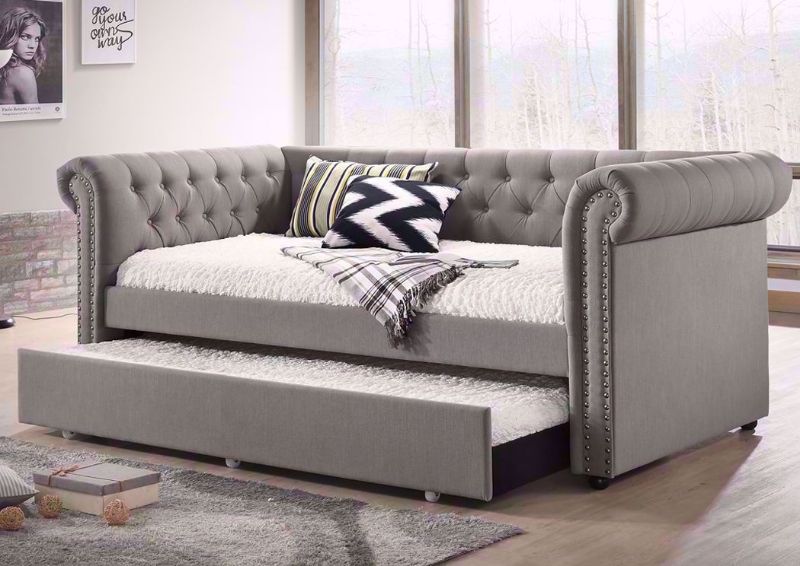 Gray Upholstered Ellie Daybed with the Trundle Open in a Room Setting | Home Furniture Plus Mattress