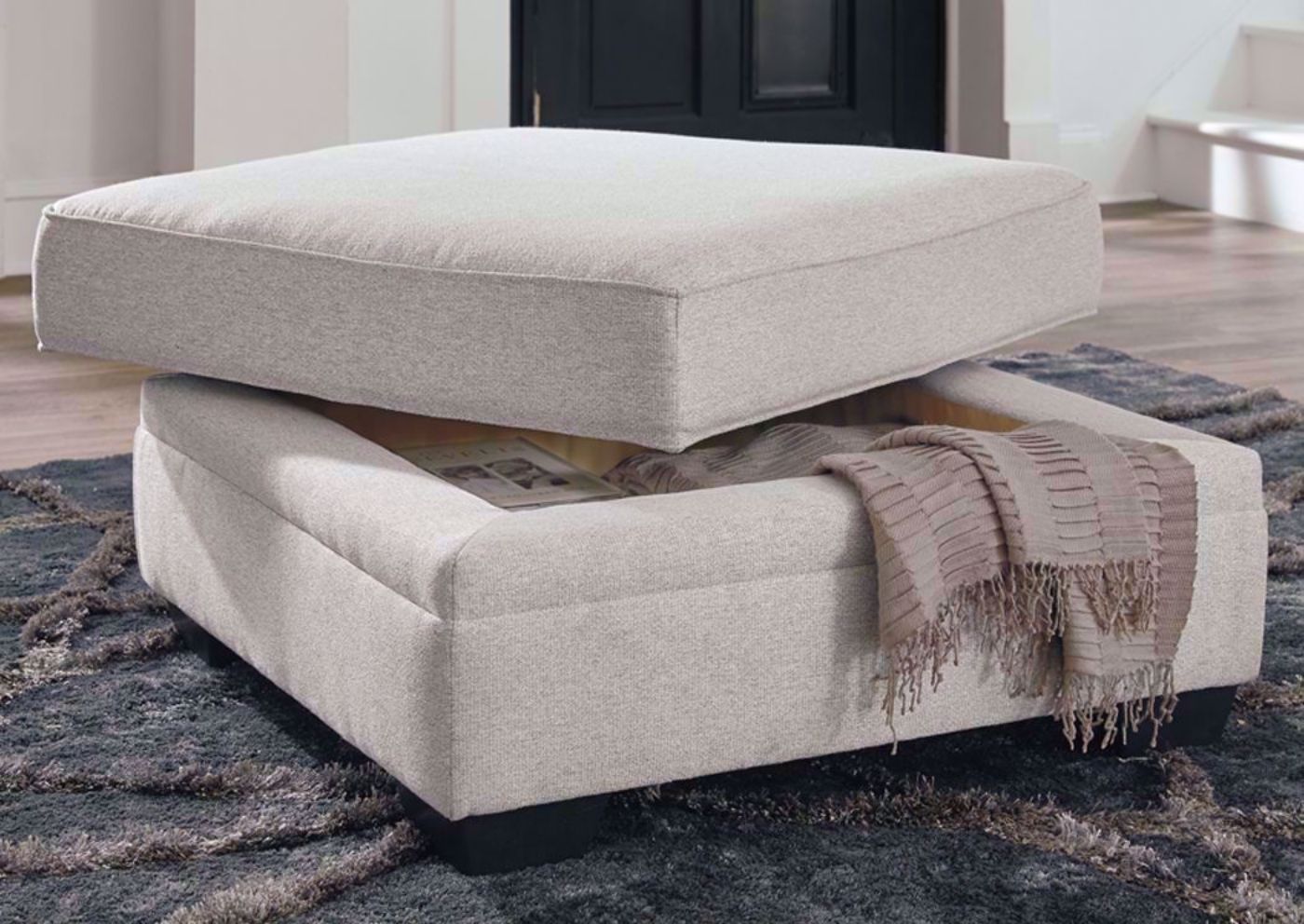 Light Beige Dellara Storage Ottoman by Ashley Furniture In Living Room Setting | Home Furniture Plus Bedding