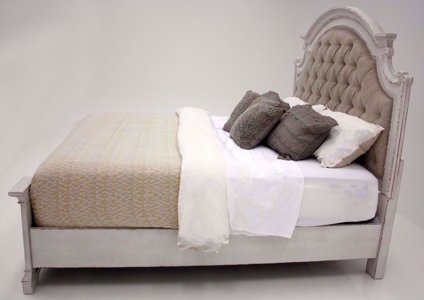 Antique White Stevenson Manor King Bed With a Upholstered Headboard Showing the Side View | Home Furniture Plus Mattress