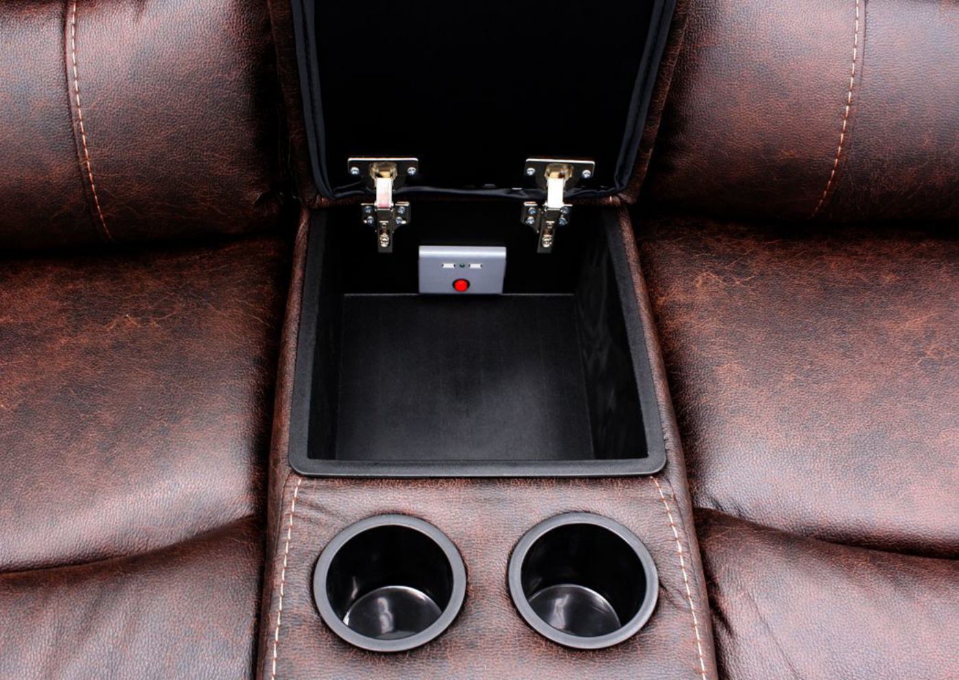 Close Up of the Center Console with Storage Area and Dual Cup Holders  on the Austin Power Reclining Sectional Sofa with Dark Brown Microfiber Upholstery | Home Furniture + Mattress