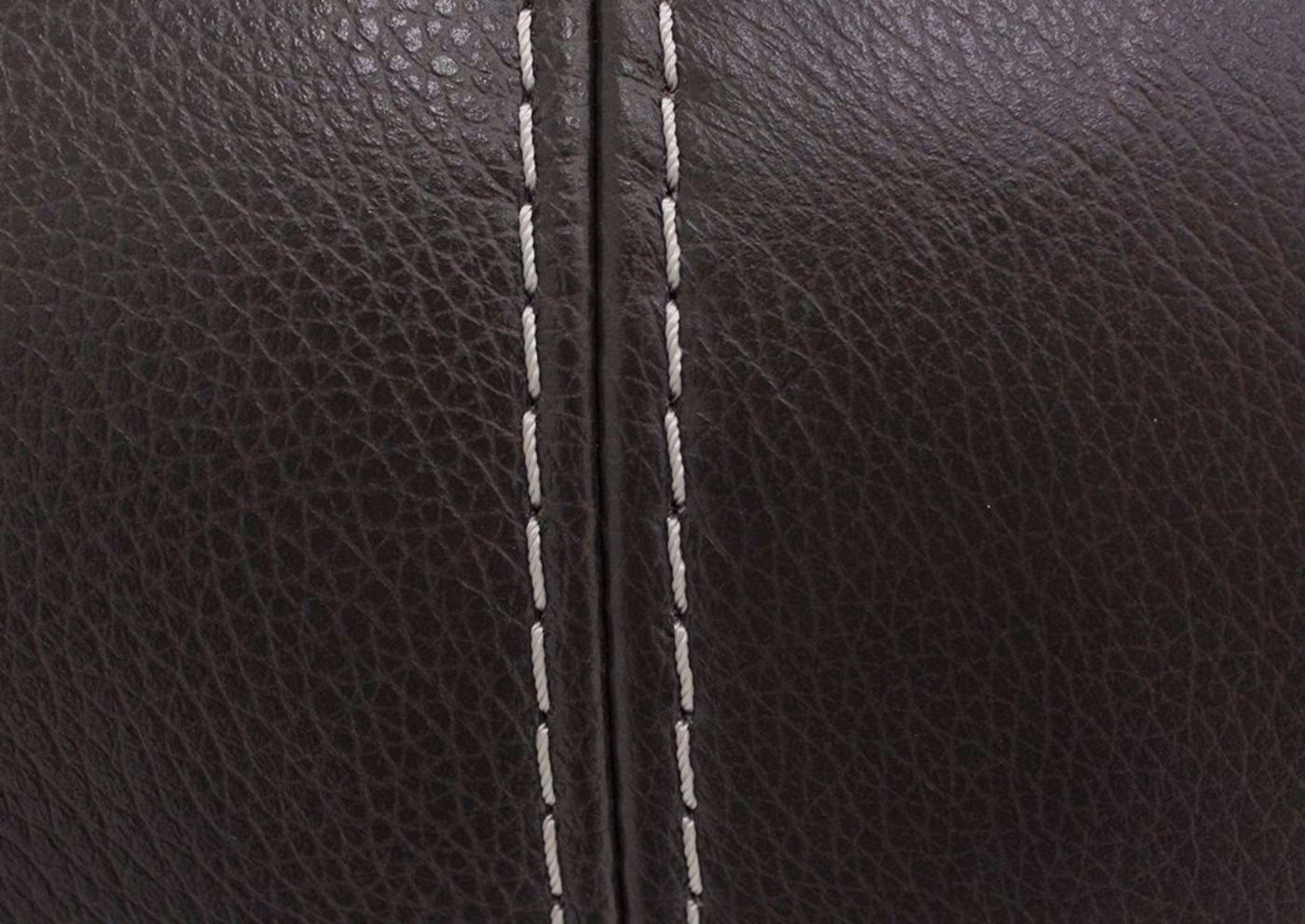 Details of the Accent Stitching and Brown Top Grain Leather Upholstery of the Amarillo Ghost Sofa, Loveseat and Recliner | Home Furniture + Mattress