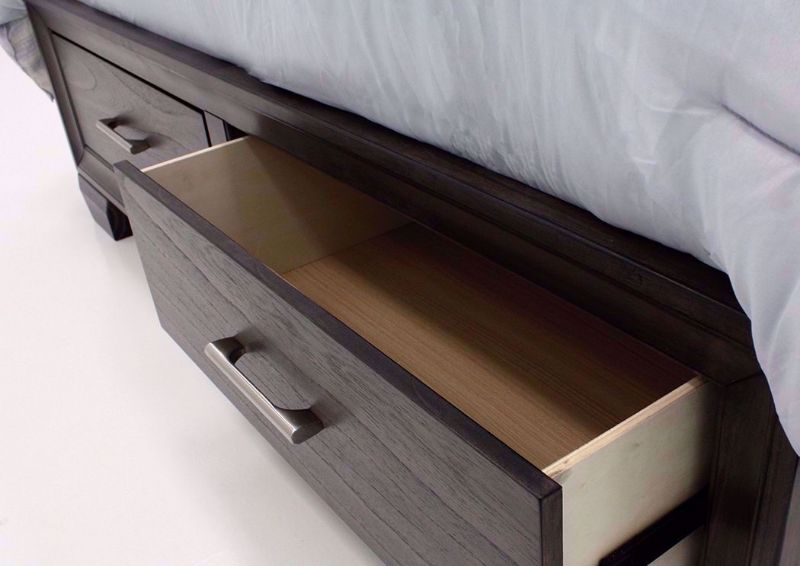 Brown Upholstered Jaymes Queen Bed Showing the Storage Footboard With a Drawer Opened | Home Furniture Plus Bedding