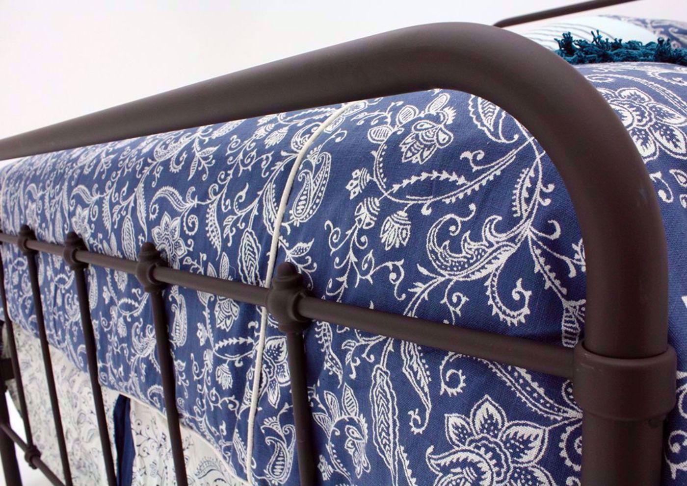 Brown Jourdan Creek Full Iron Bed Showing the Footboard at an Angle | Home Furniture Plus Bedding