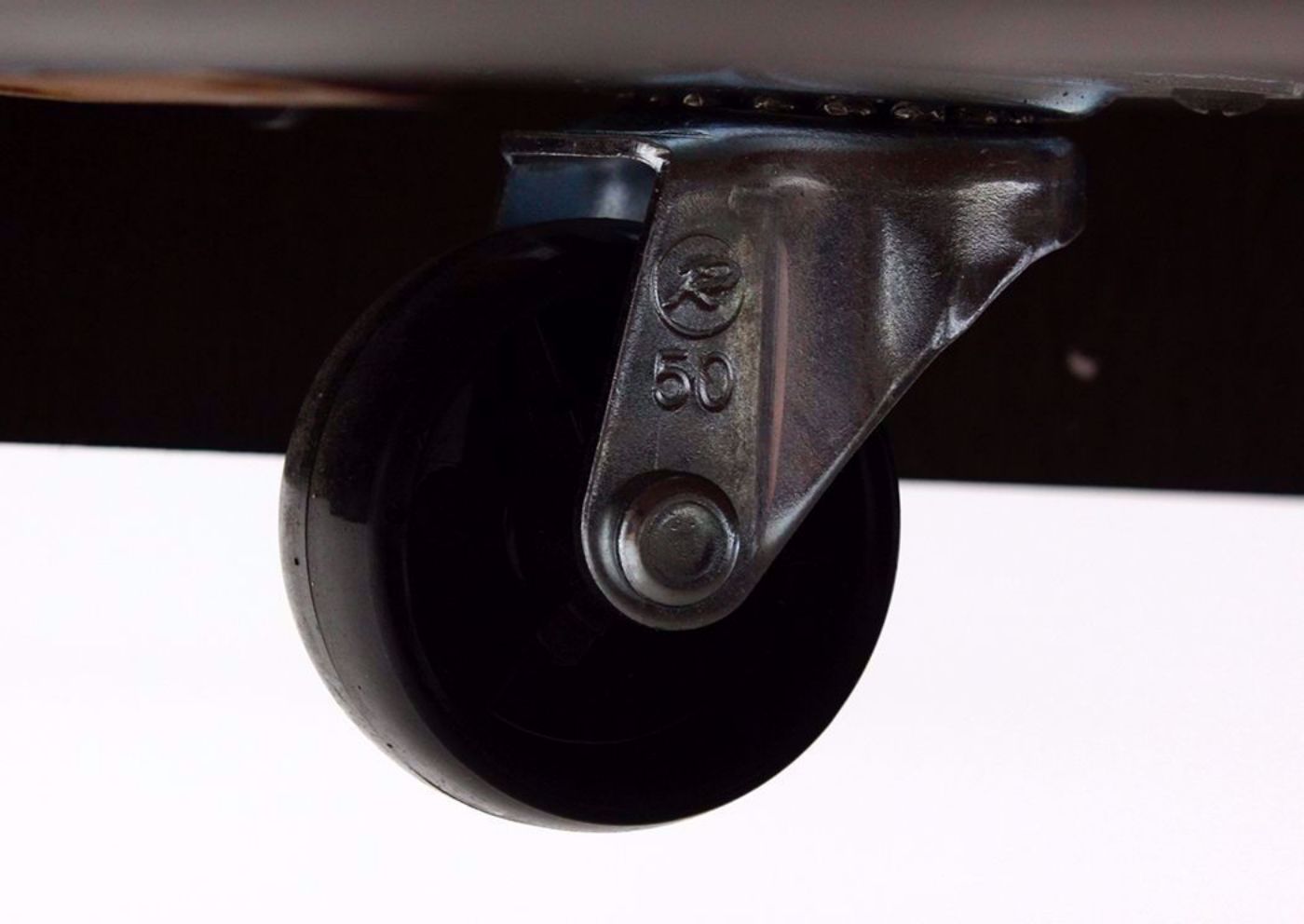 Castor Wheel on the Bottom of the Budmore Coffee Table by Ashley Furniture | Home Furniture Plus Bedding