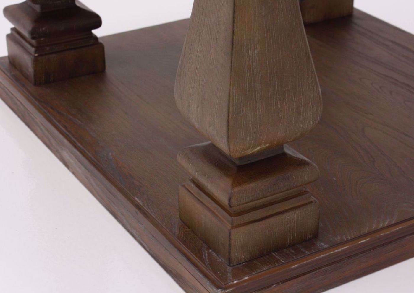 Bottom Corner with Leg and Lower Storage Area of the Johnelle End Table by Ashley Furniture with a Weathered Gray and Brown Finish | Home Furniture Plus Mattress