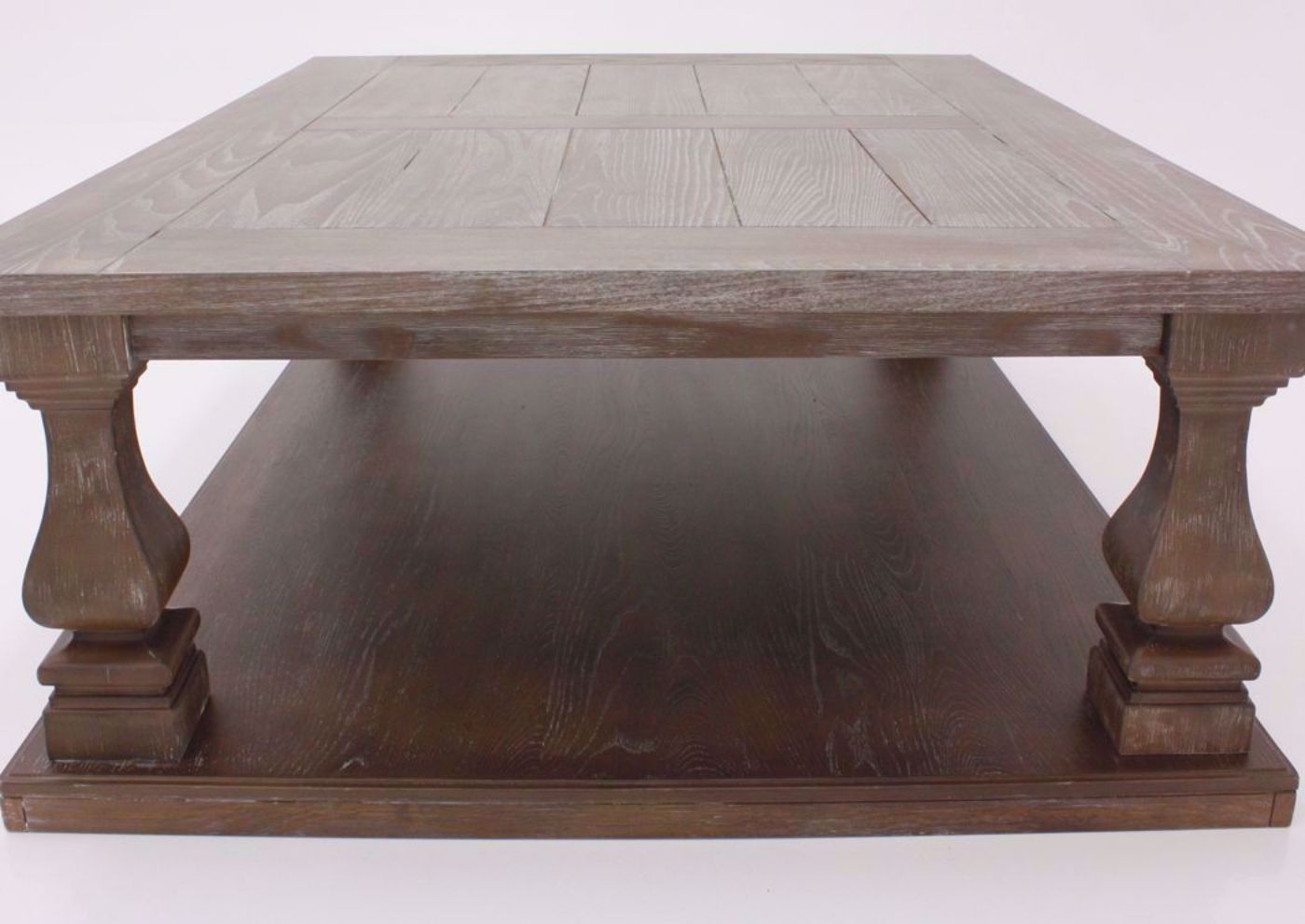 Side End View of  the Johnelle Coffee Table by Ashley Furniture with a Weathered Gray and Brown Finish | Home Furniture Plus Mattress