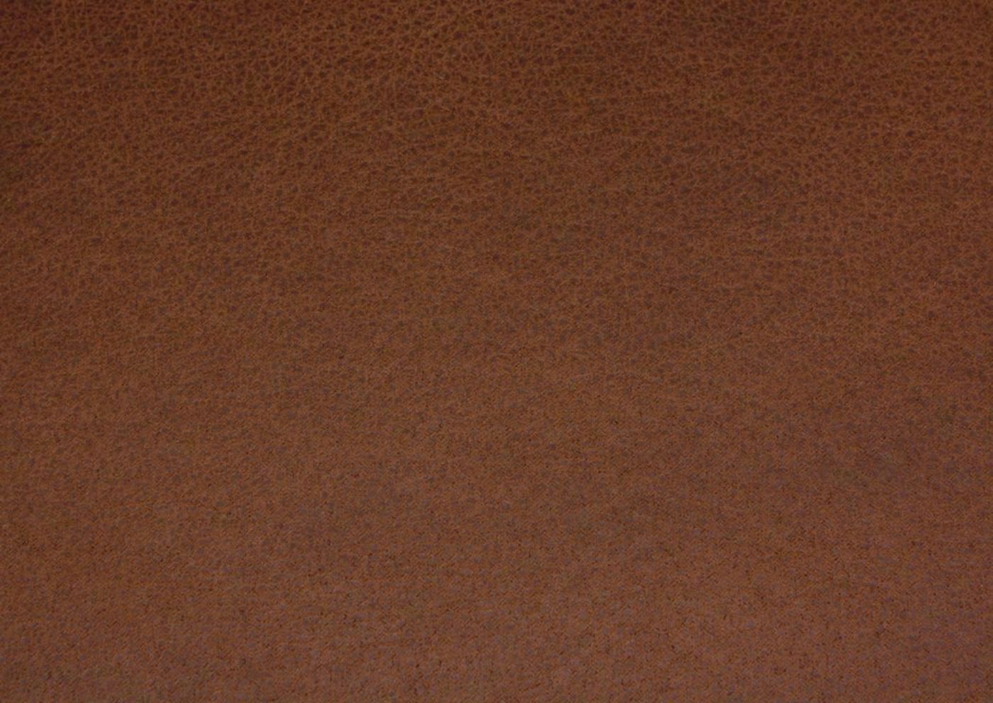 Close Up of Saddle Brown Upholstery on the McGann Rocker Recliner by Ashley Furniture | Home Furniture Plus Bedding