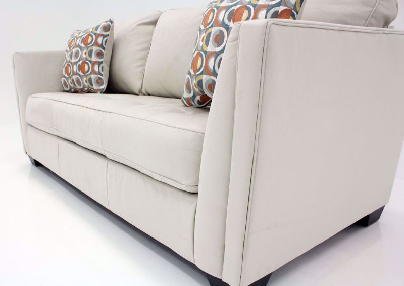 Close Up of Front Corner of the Ivory Filone Sofa by Ashley Furniture with Accent Pillows | Home Furniture Plus Mattress