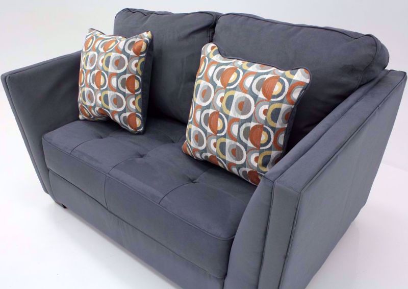 Slightly Angled View of the Steel Gray Filone Loveseat by Ashley Furniture with Accent Pillows | Home Furniture + Mattress