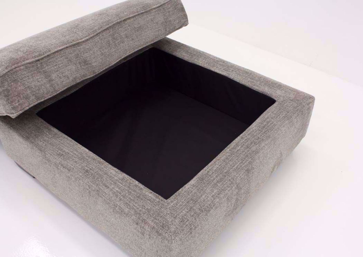Wide Opened Cushioned Top on the Brown Upholstered Bovarian Storage Ottoman by Ashley Furniture | Home Furniture Plus Bedding