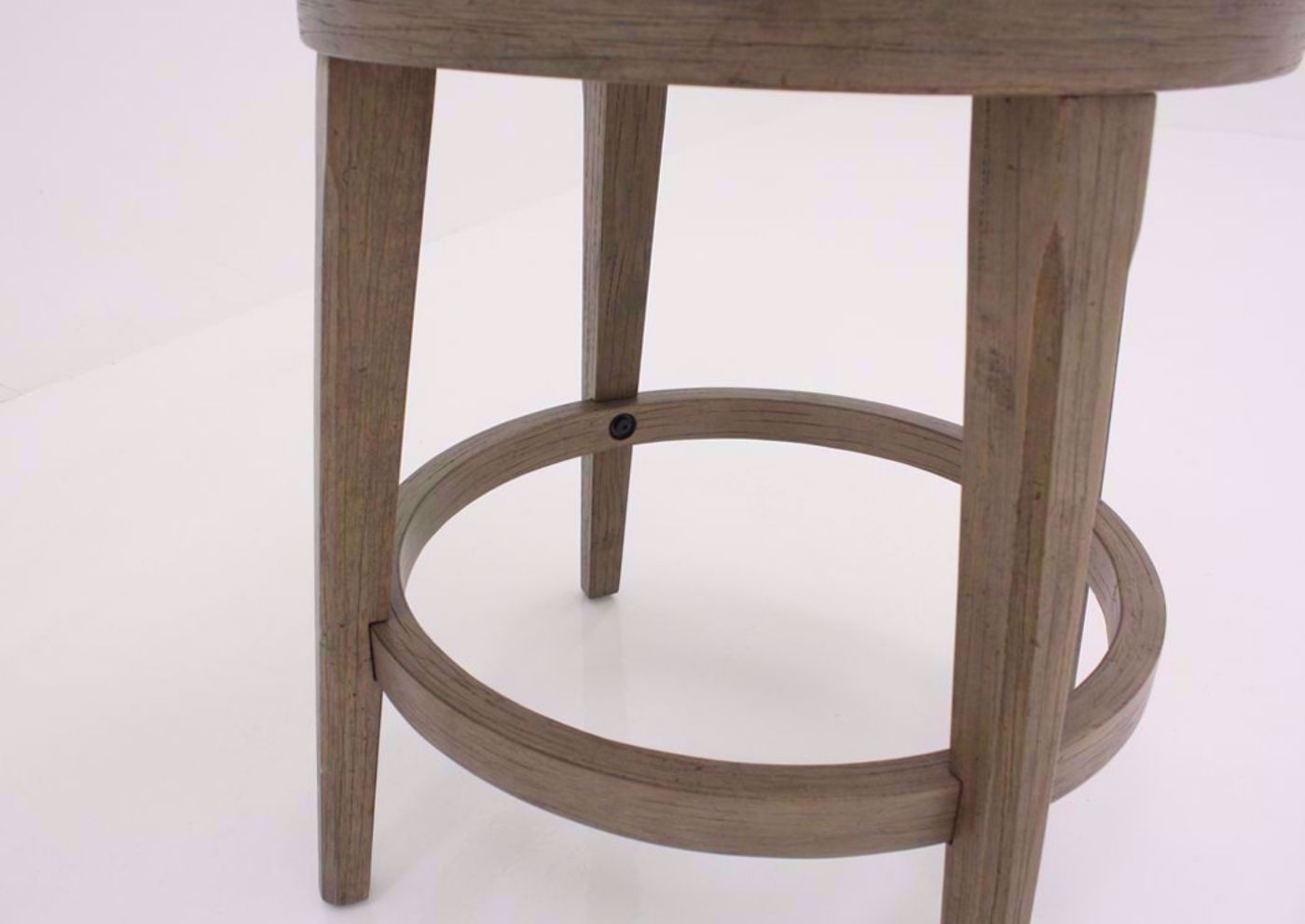 Gray and Beige Chesney 24 Inch Swivel Barstool Showing the Wood Leg Details | Home Furniture Plus Mattress