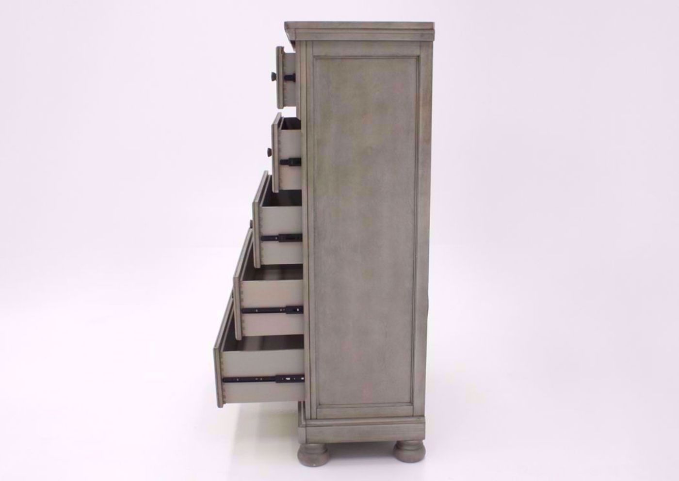 Distressed Light Gray Lettner Chest of Drawers by Ashley Furniture Showing the Side View With the Drawers Open | Home Furniture Plus Bedding