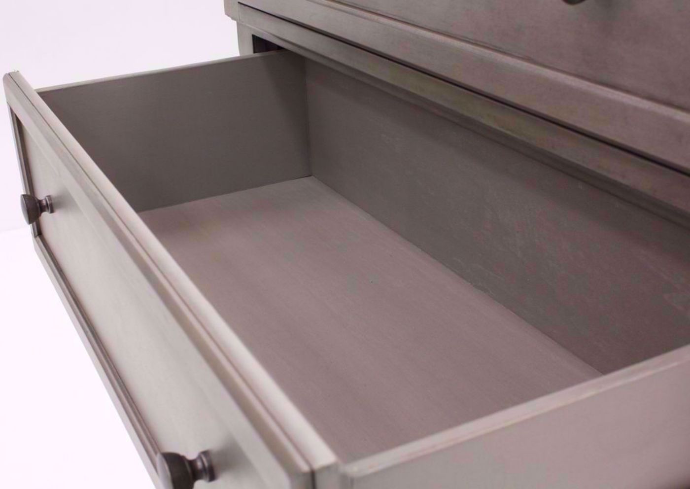 Distressed Light Gray Lettner Chest of Drawers by Ashley Furniture Showing the Wood Lined Drawer Interior | Home Furniture Plus Bedding