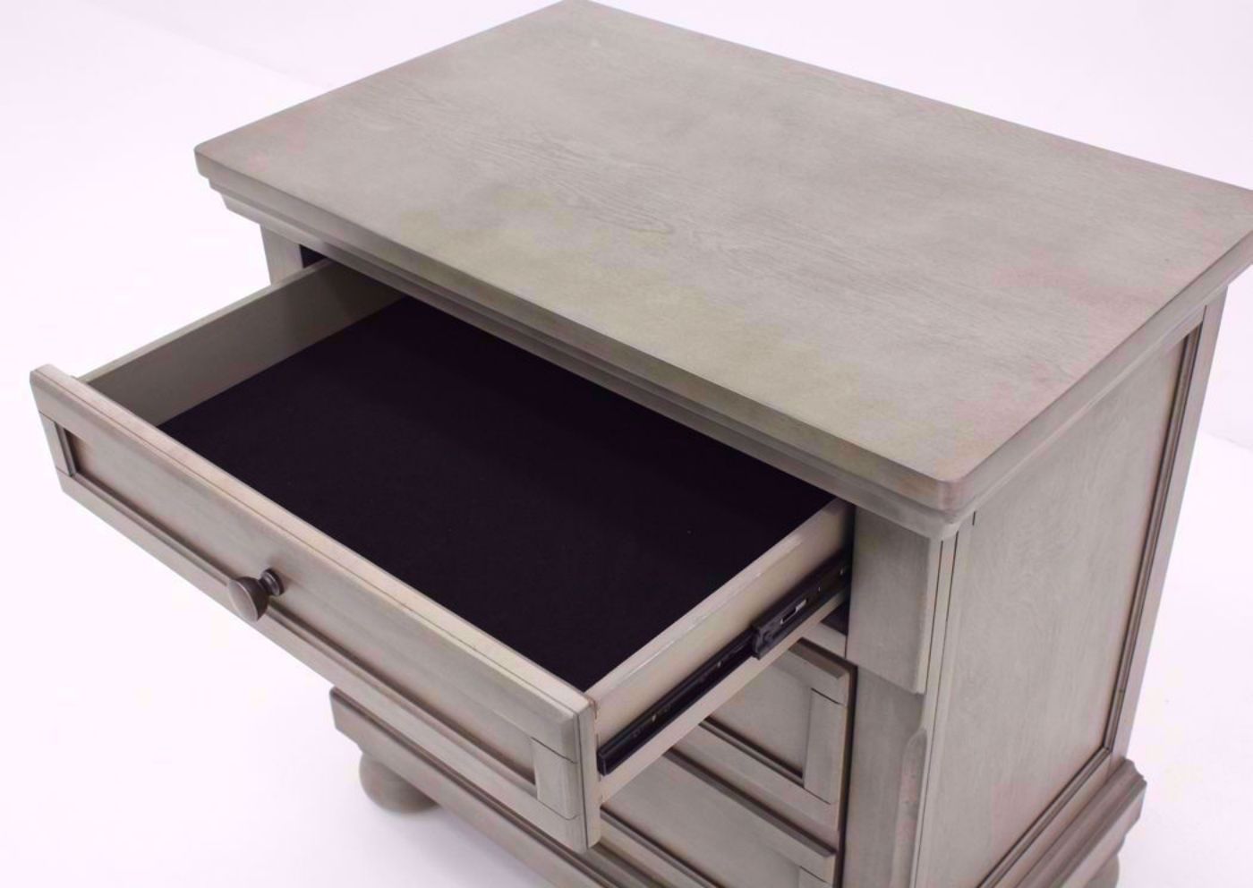 Light Gray Lettner Nightstand by Ashley Furniture at an Angle With the Top Felt Lined Drawer Open | Home Furniture Plus Mattress