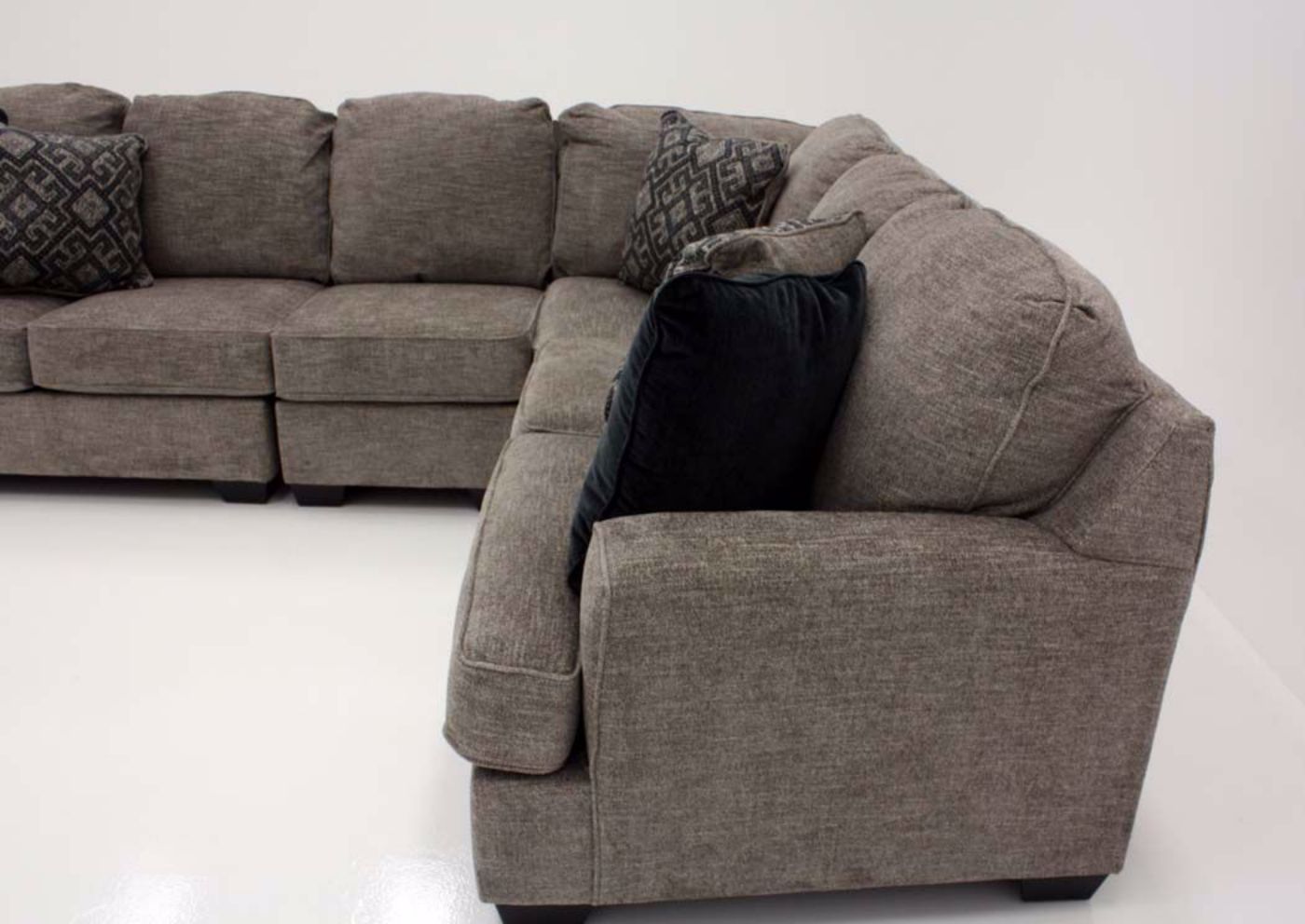 Brown Bovarian Sectional Sofa - Left Facing by Ashley Furniture, Left Loveseat Side View, Mood Shot | Home Furniture Plus Bedding