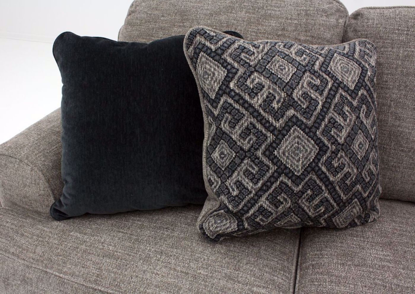 Brown Bovarian Sectional Sofa - Left Facing by Ashley Furniture, Accent Pillows Detail | Home Furniture Plus Bedding