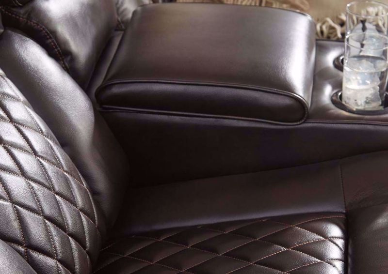Slightly Angled View Warnerton POWER Reclining Loveseat by Ashley Furniture, Mood Shot of the Console with Cupholders Detail | Home Furniture Plus Bedding