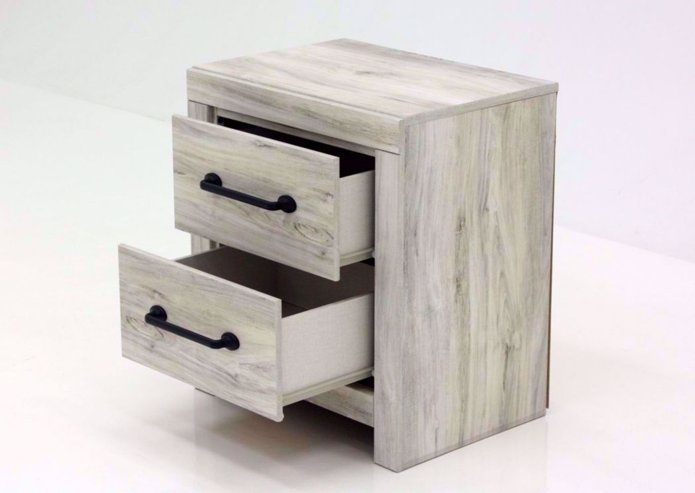 Rustic White Cambeck Nightstand by Ashley Furniture at an Angle with the Drawers Open | Home Furniture Plus Mattress