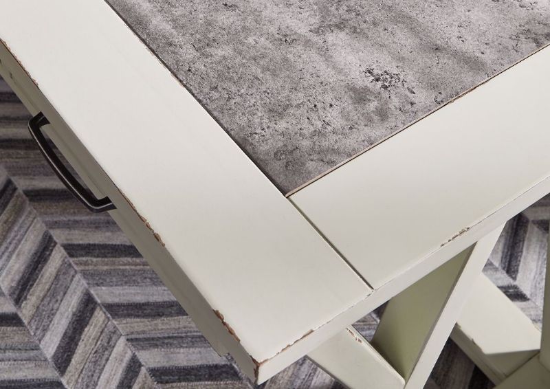 Jonileen Desk by Ashley Furniture with 3 Drawers and Open Base, Table Top Corner Detail | Home Furniture Plus Mattress