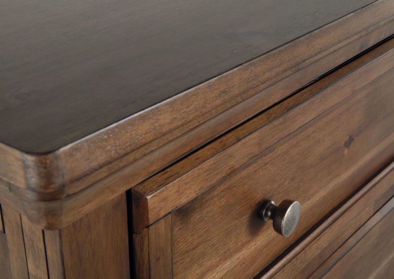 Tobacco Brown Flynnter Chest of Drawers by Ashley Furniture Showing the Corner Finish Detail | Home Furniture Plus Bedding