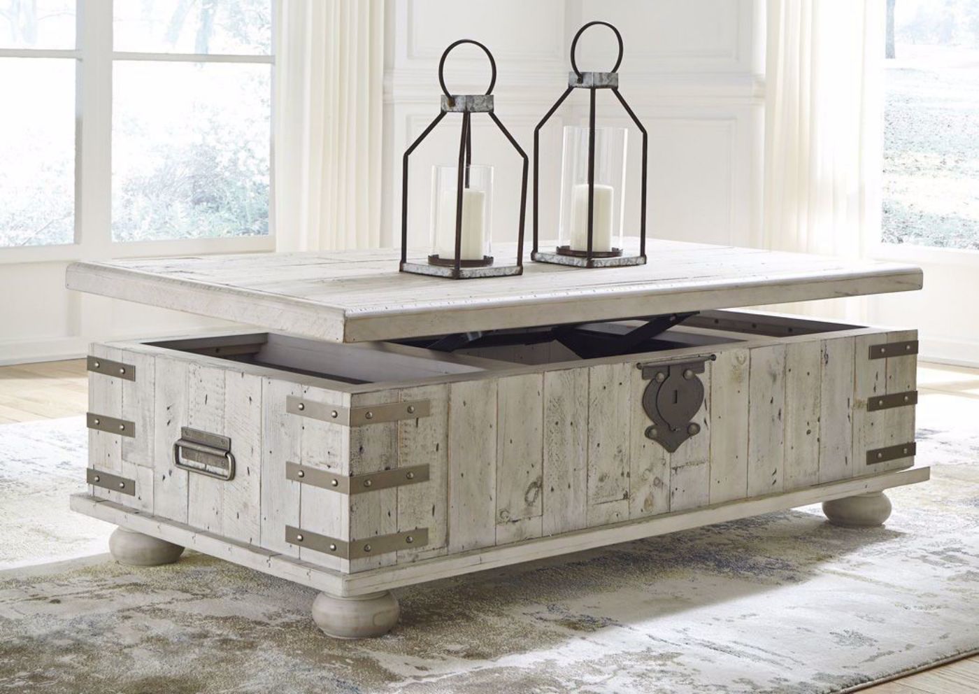 Room Shot of the Light Gray Carynhurst Coffee Table by Ashley Furniture with Top Slightly Lifted | Home Furniture Plus Bedding