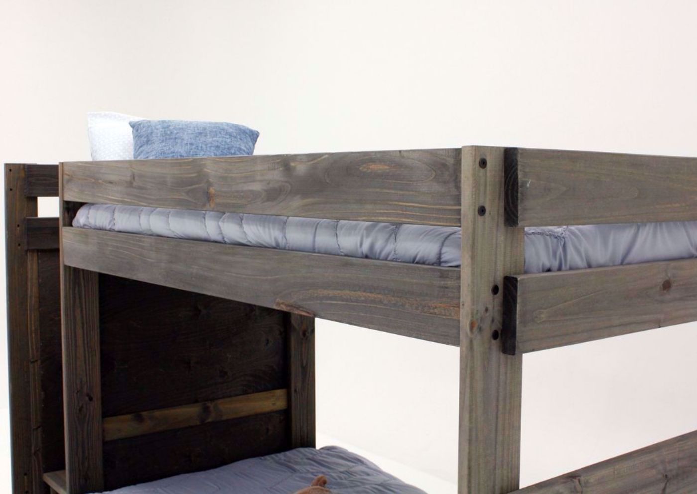 Brown Duncan Twin & Twin Staircase Bunk Bed at an Angle Showing the Top Rails | Home Furniture Plus Mattress