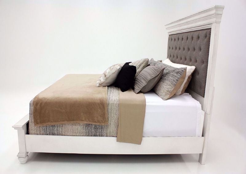 Distressed White Kanwyn Upholstered Queen Size Bed by Ashley Showing the Side View | Home Furniture Plus Mattress