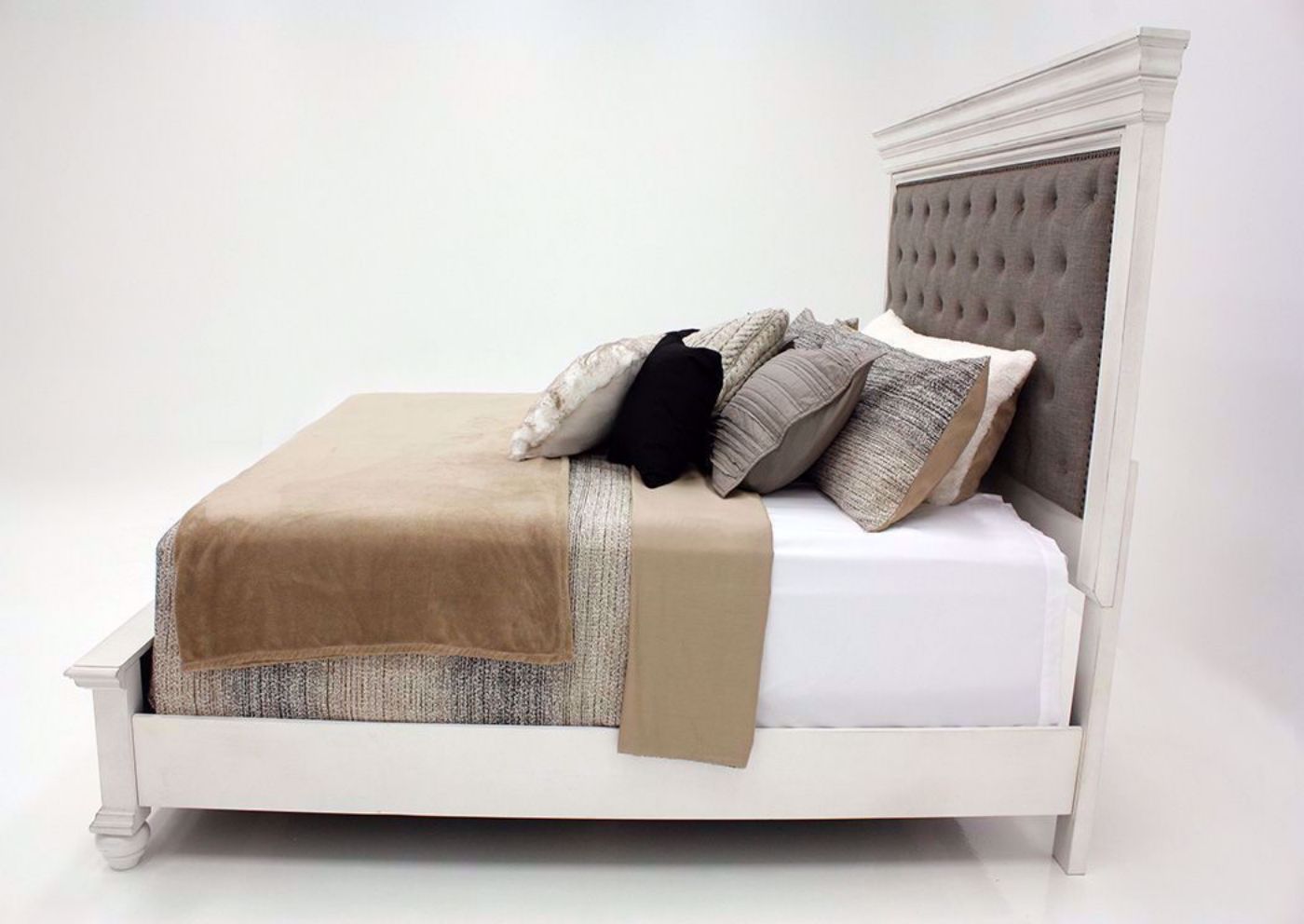 Distressed White Kanwyn Upholstered King Size Bed by Ashley Showing the Side View | Home Furniture Plus Mattress