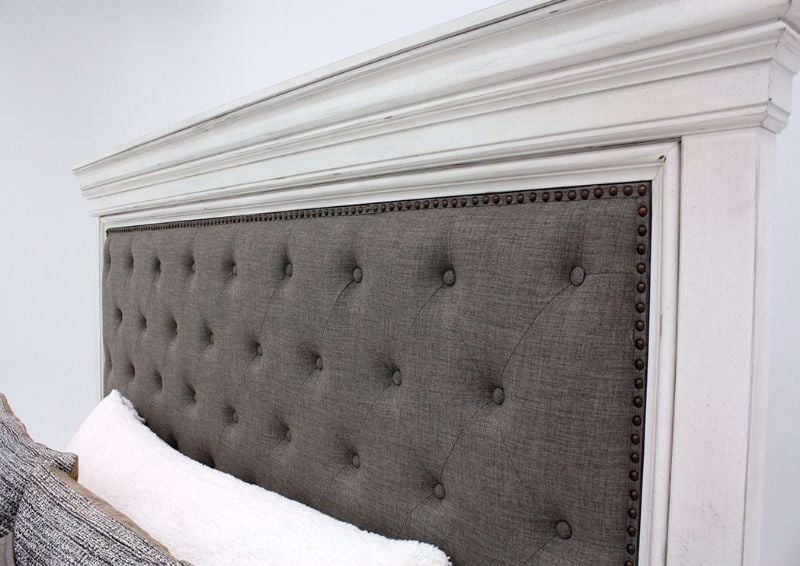 Distressed White Kanwyn Upholstered King Size Bed by Ashley Showing the Headboard | Home Furniture Plus Mattress