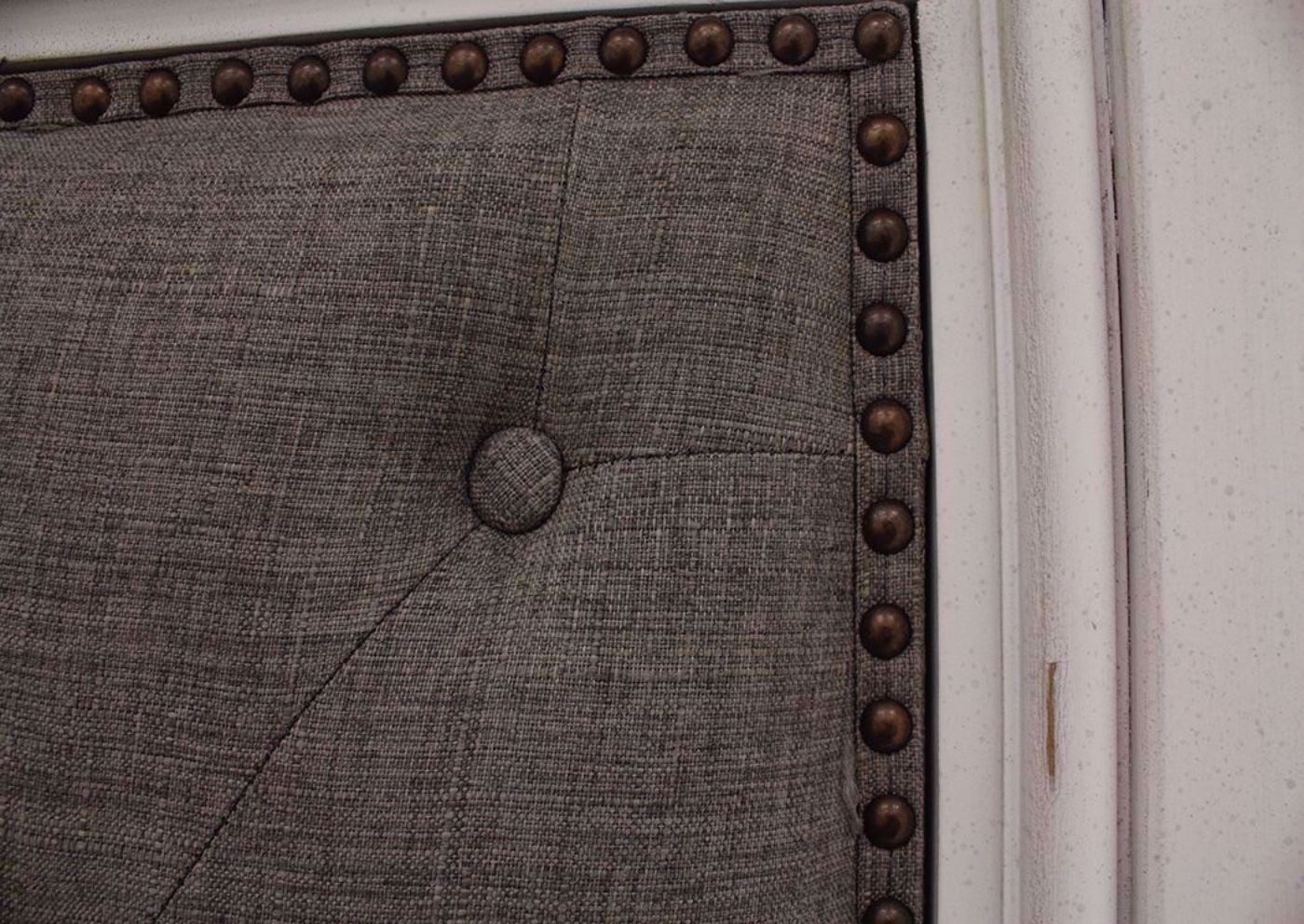 Distressed White Kanwyn Upholstered King Size Bed by Ashley Showing the Headboard Upholstery Detail | Home Furniture Plus Mattress