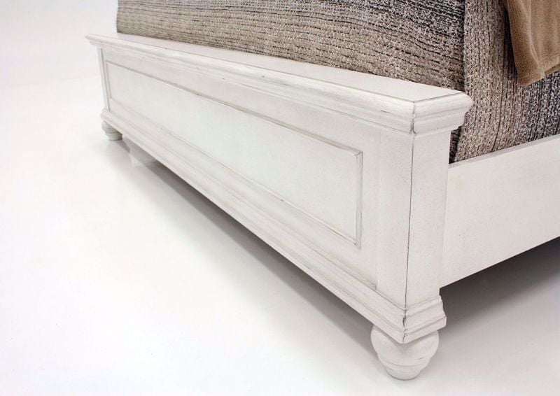 Distressed White Kanwyn Upholstered King Size Bed by Ashley Showing the Footboard Detail | Home Furniture Plus Mattress