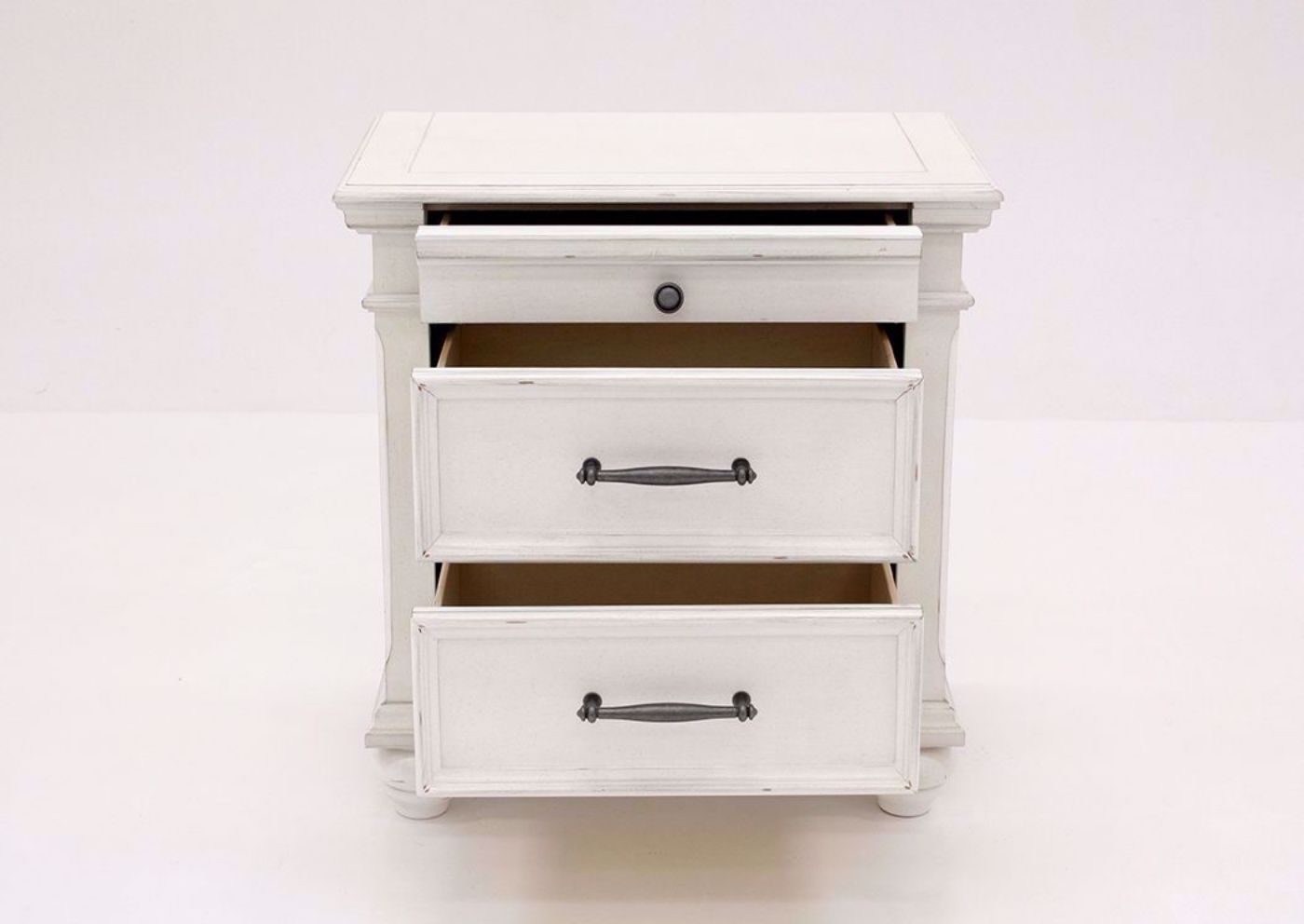 Distressed White Kanwyn 3 Drawer Nightstand by Ashley Facing Front With the Drawers Open | Home Furniture Plus Mattress