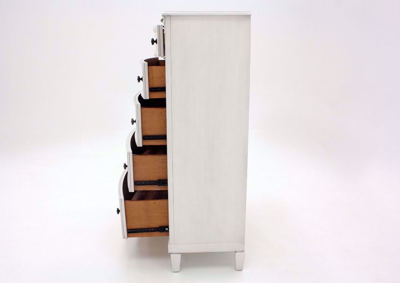 White Mallory Chest of Drawers by Standard Showing the Side View With the Drawers Open | Home Furniture Plus Mattress