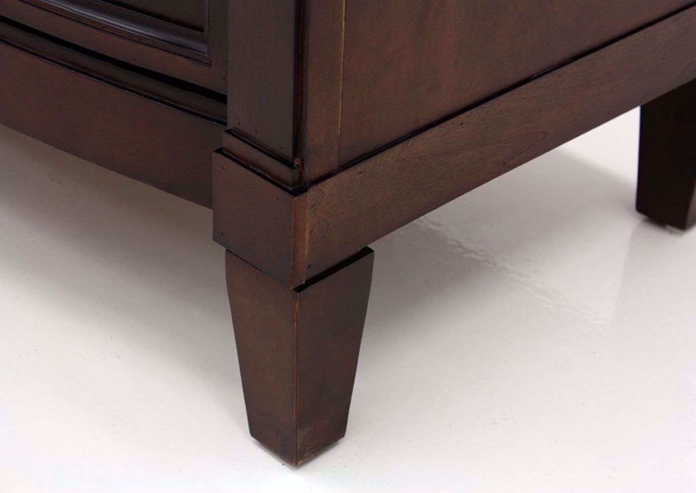 Brown Mallory Chest of Drawers by Standard Showing the  Foot Detail | Home Furniture Plus Mattress