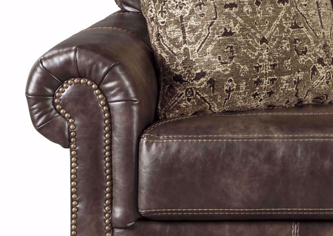 Arm Details with Accent Pillow on Nicorvo Sofa by Ashley | Home Furniture Plus Bedding