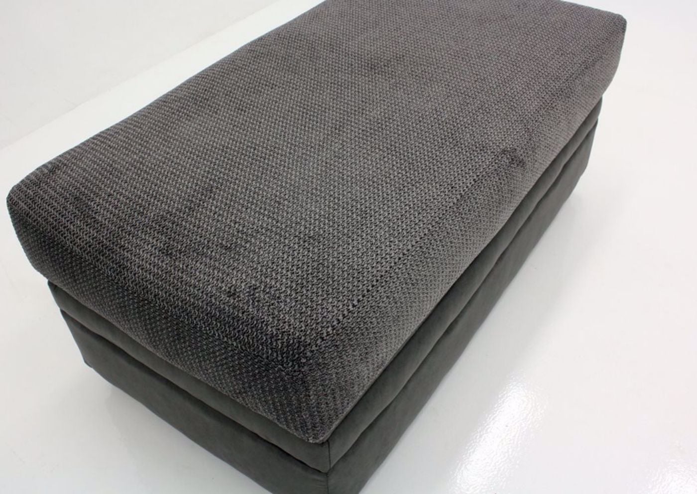 Gray Akan Storage Ottoman At an Angle in a Mood Shot | Home Furniture Plus Bedding