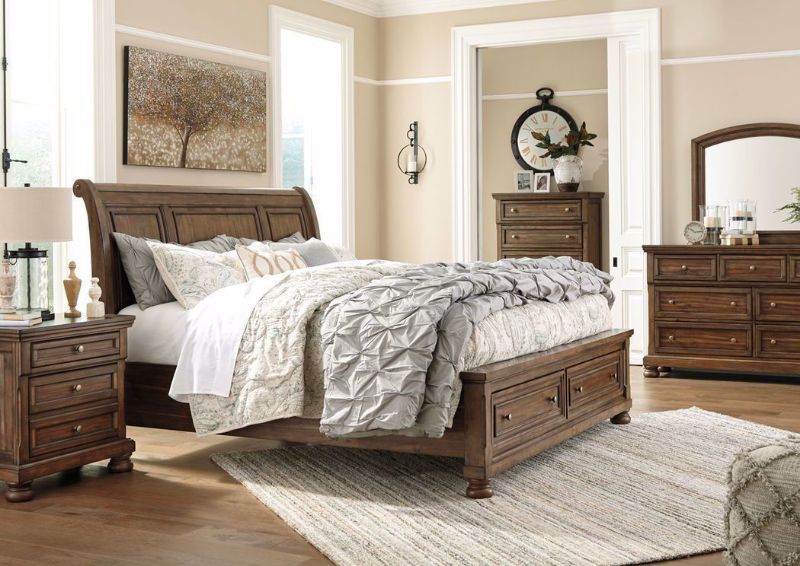 Room View of the Flynnter Bedroom Set by Ashley with a Warm Brown Finish | Home Furniture Plus Bedding