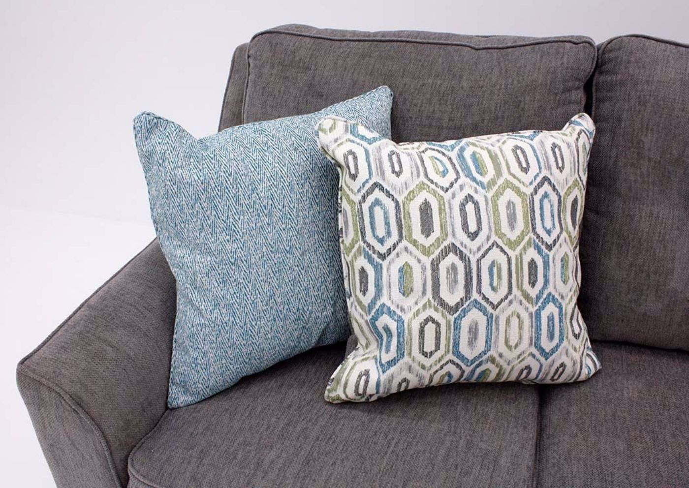 Smoke Gray Surge Sectional Sofa by Lane Showing Two Patterned Accent Pillows | Home Furniture Plus Bedding