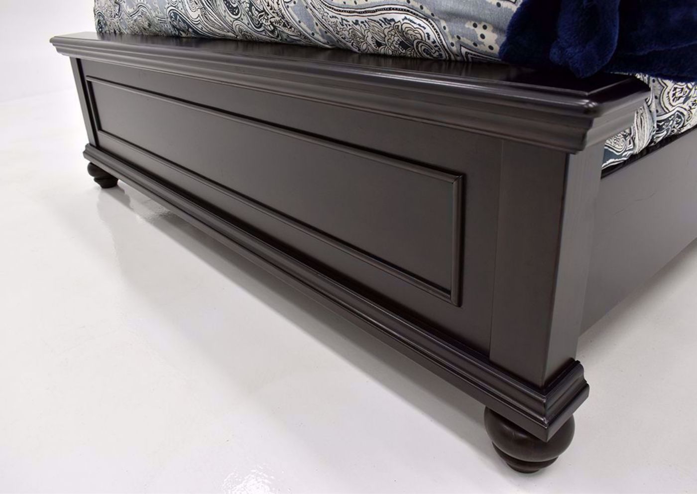 Dark Brown Brynhurst Upholstered King Size Bed by Ashley Furniture Showing the Footboard | Home Furniture Plus Mattress