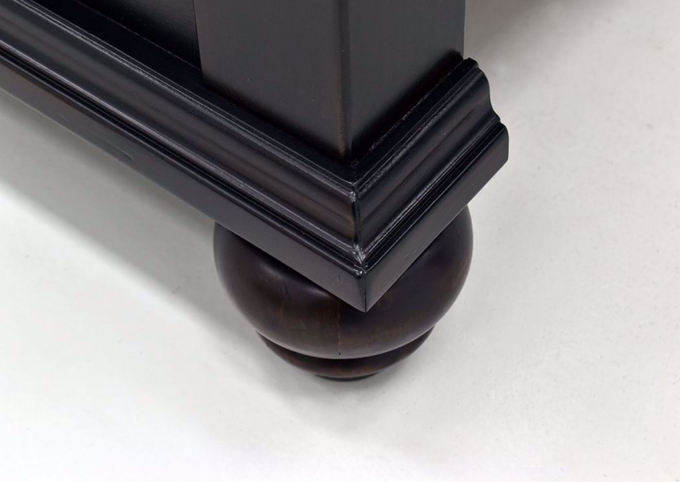 Dark Brown Brynhurst Upholstered King Size Bed by Ashley Furniture Showing the Turned Foot Detail | Home Furniture Plus Mattress