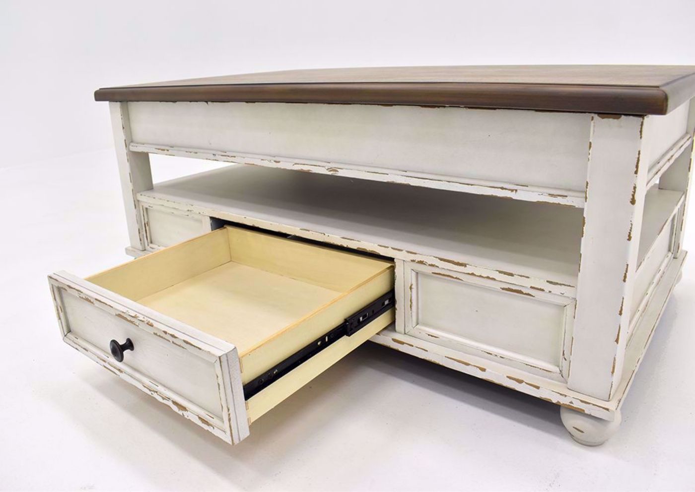 Distressed White Realyn Lift Top Coffee Table by Ashley Furniture Showing the Drawer Interior | Home Furniture Plus Mattress