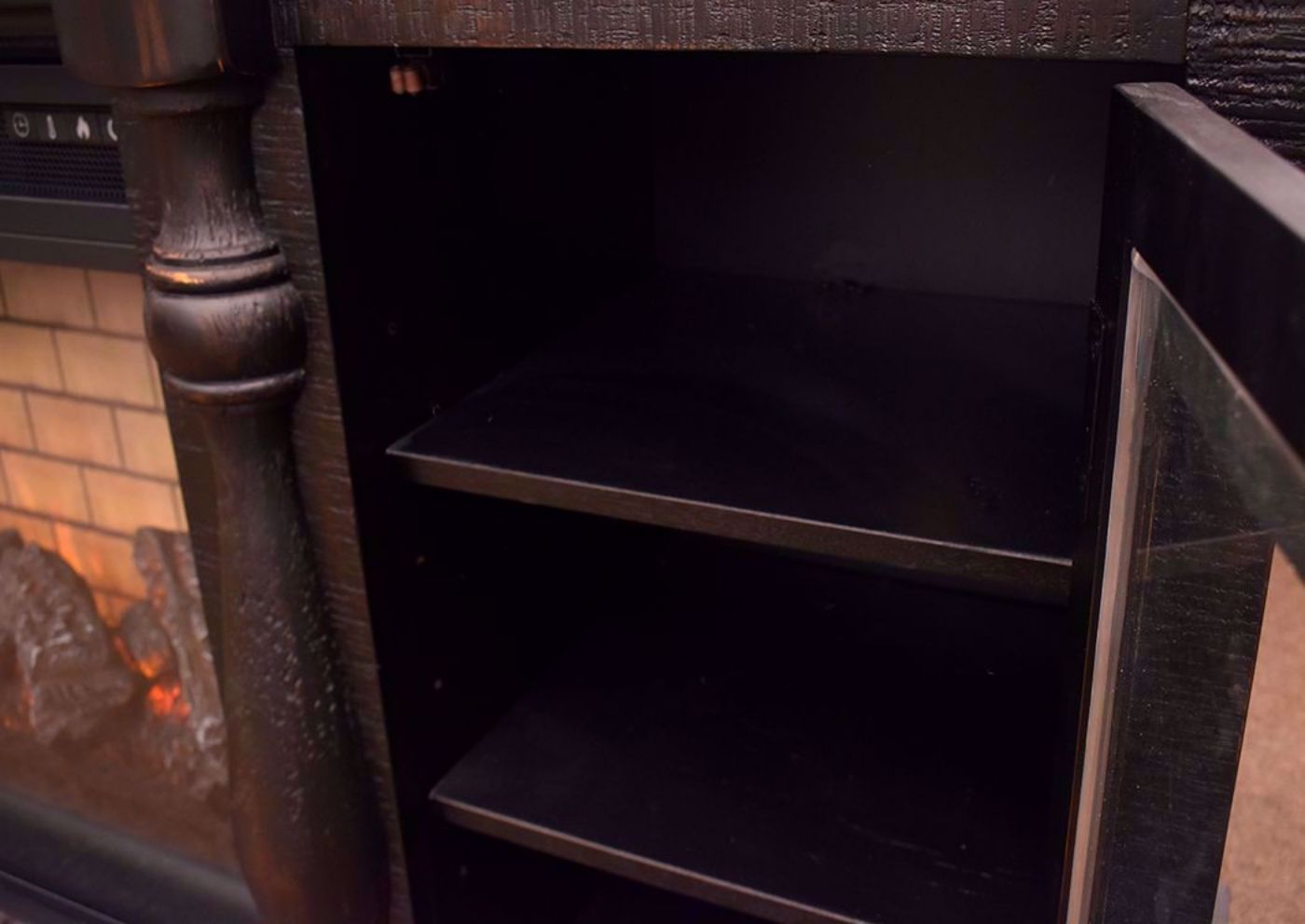 Black Mallacar TV Stand with Fireplace by Ashey Furniture Showing the Shelves | Home Furniture Plus Mattress