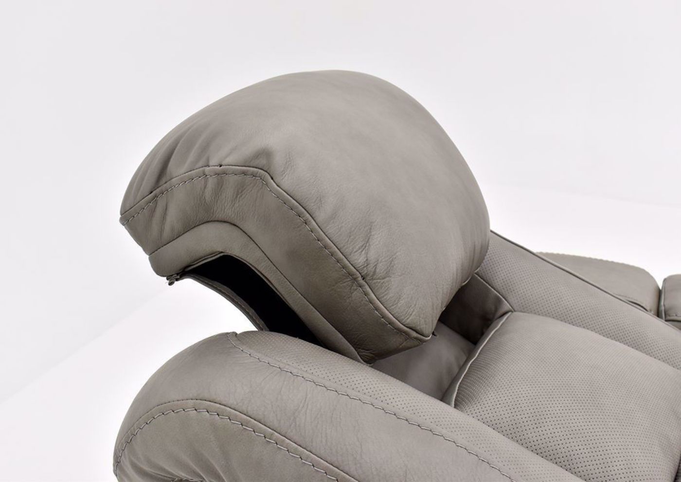 Gray Leather Man-Den Power Reclining Loveseat by Ashley Furniture Showing the Articulated Headrest | Home Furniture Plus Bedding