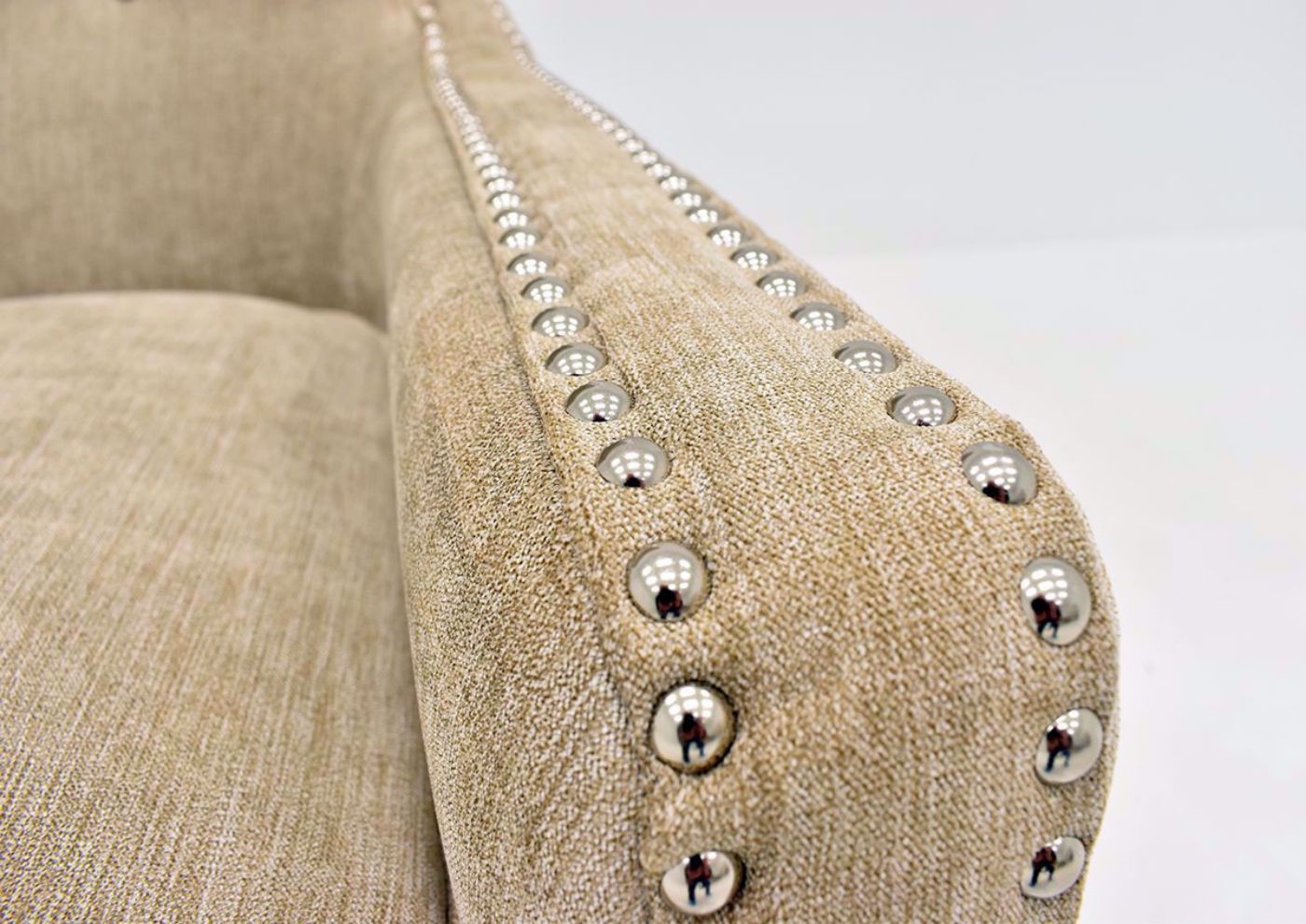 Tan Beige Riker Accent Chair close up of nail head trim on arm | Home Furniture Plus Bedding