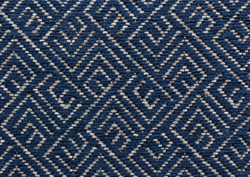 Close Up Showing Geometric Patterned Upholstery Fabric on the Ellison Swivel Accent Chair - Dark Blue | Home Furniture Plus Bedding
